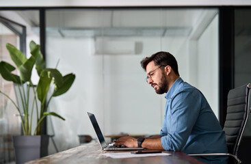 Young male worker software developer, busy professional business man company employee, Latin...
