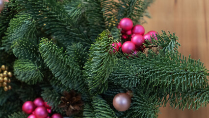 Christmas and New Year background. Christmas tree branch with hanging ball.