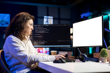 Programmer doing software debugging on isolated screen PC at home, checking broken lines of code...