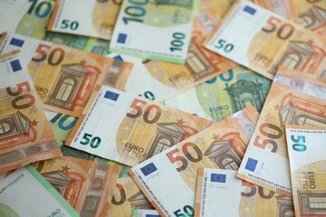 Pile of euro paper banknotes as finance background. Financial, saving or investment