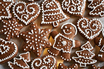 Homemade gingerbread Christmas cookie decorated with white icing , top view