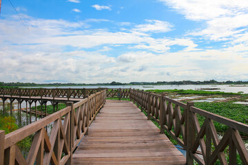 Obraz premium Wooden Bridge with a background of cloudy blue sky. Located in Boyolali