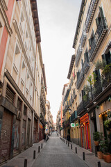 European narrow street with historic balconies, free on dry cloudy clear sky day