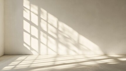 Obraz premium Window Light Casts Shadows On A White Wall And Floor