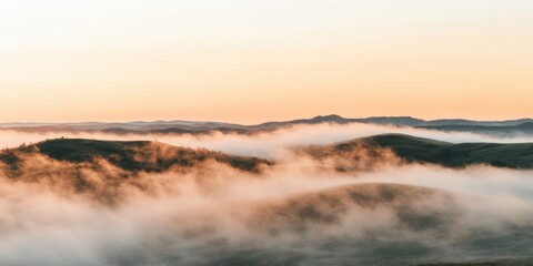 Obraz premium Misty Sunrise Over Rolling Hills Serene Nature Landscape Beautiful Foggy Environment Captivating Viewpoint Tranquil Concept for Outdoor Enthusiasts