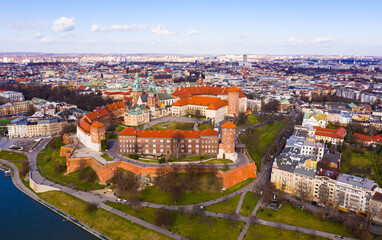 Fototapeta premium Aerial view of Wawel Hill with fortified Castle complex and belfry of Cathedral of Saints Stanislaus and Wenceslaus on sunny spring day, Krakow, Poland..