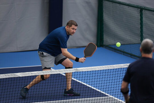 Pickleball doubles played indoors