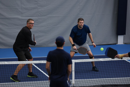 Pickleball doubles played indoors