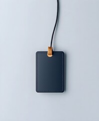 Black price tag with empty space for text on light background. A simple black label with rounded corners