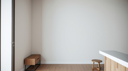 Minimalist room interior with off-white walls, light wood flooring, a small wooden bench with a drawer, a low wooden stool, and a partial view of a light wood and white countertop.