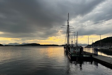 Boat in the ocean at Sunset in the Harbor of Oban, Scotland