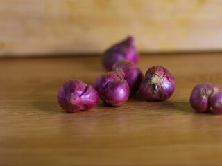 purple onion on wooden table