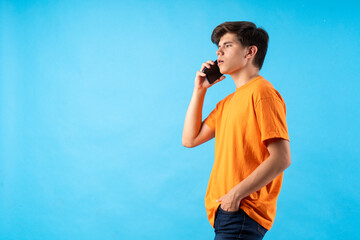 Young person expressing various emotions and body pains, pointing, using a cellphone, with colored backgrounds and wearing shirts of different colors