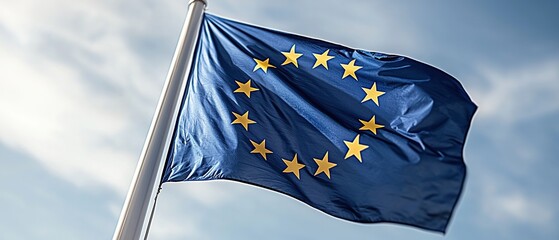 A blue flag featuring a circle of yellow stars, symbolizing the European Union.