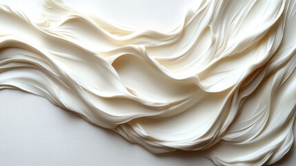 Obraz premium A textured wave of creamy white resembling soft fabric or frosting.