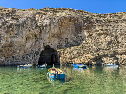 The Inland Sea and tourist boat. Dwejra is a lagoon of seawater on the island of Gozo.