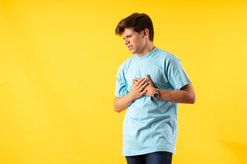 Young person expressing various emotions and body pains, pointing, using a cellphone, with colored...