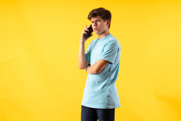 Young person expressing various emotions and body pains, pointing, using a cellphone, with colored...