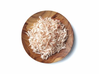 Dried salted baby shrimp on plate isolated on white background 