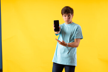 Young person expressing various emotions and body pains, pointing, using a cellphone, with colored...