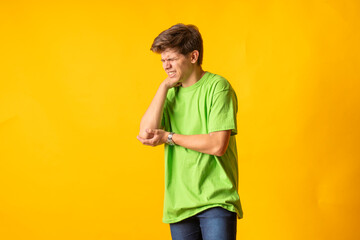 Young person expressing various emotions and body pains, pointing, using a cellphone, with colored...