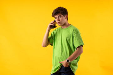 Young person expressing various emotions and body pains, pointing, using a cellphone, with colored...