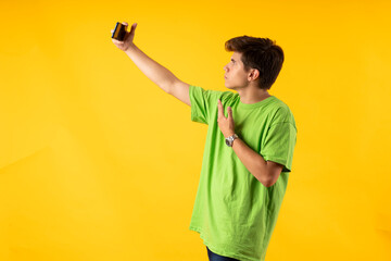 Young person expressing various emotions and body pains, pointing, using a cellphone, with colored...