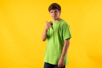 Young person expressing various emotions and body pains, pointing, using a cellphone, with colored...