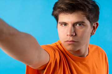 Young person expressing various emotions and body pains, pointing, using a cellphone, with colored...