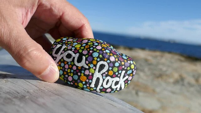 You rock kindness rock being moved around by hand
