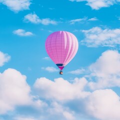 Fototapeta premium Pink Hot Air Balloon Soaring Through a Cloudy Sky