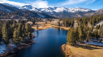 Aerial View of a Serene Alpine Lake Surrounded by Mountains