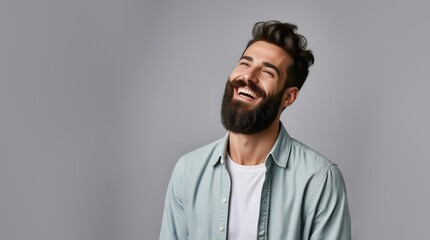 Fototapeta premium Man laughing. Happy smiling young beauty man laughing. Portrait Of Young Handsome Man Smiling. Closeup face of smiling casual man. Happy male model.