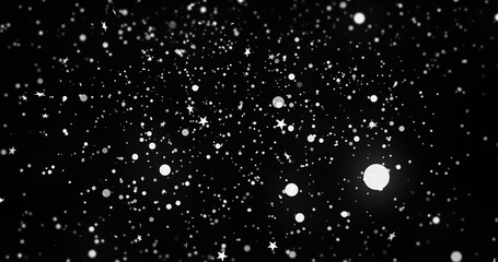 Fototapeta premium Image of snow and stars on black background