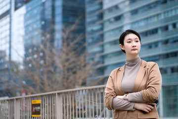 Confident Businesswoman in Urban Setting Embraces Modern Professionalism