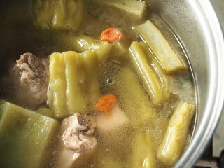 bitter gourd or melon soup with pork bones and goji berries