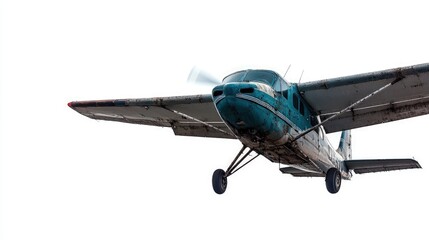 Teal vintage propeller plane in flight, isolated on white.