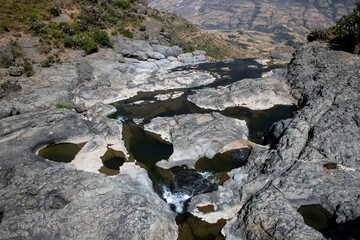 water between rocks on a plateau at the river Gur in the Ethiopian mountains