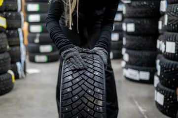 Mechanic keeps new studded car tires in garage.  © Михаил Решетников