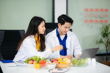 Doctors sharing fresh vegetables, promoting health and nutrition. Ideal for wellness, healthcare, and science themes.