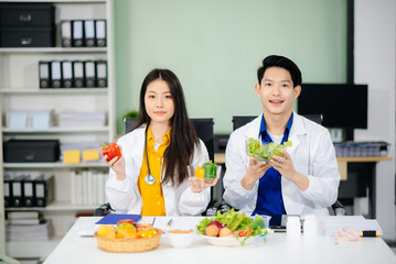 Doctors sharing fresh vegetables, promoting health and nutrition. Ideal for wellness, healthcare,...