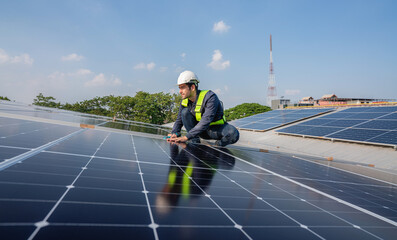 Engineer service check installation solar cell on the roof of factory. Silhouette technician...