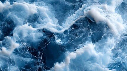 Obraz premium Close-up of ocean waves with white foam and deep blue water.
