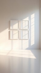 A white room with four white frames on the wall
