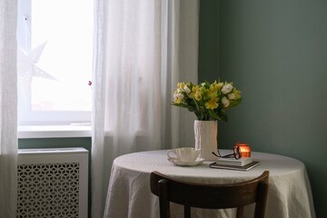 A Cozy Interior Featuring Beautiful Flowers and Soft Candles in Warm, Inviting Tones