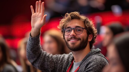 Obraz premium A student raises his hand in a lecture, asking a question and seeking information or feedback from the instructor.