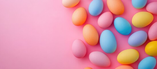 Vibrant Easter Eggs on Pink Background with Copy Space for Text or Seasonal Greetings
