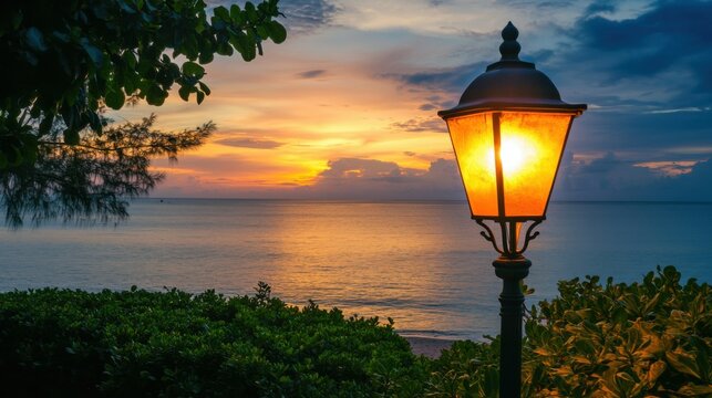 Public classic lights lamp at beach side with landscape view of sunset sky at behinds
