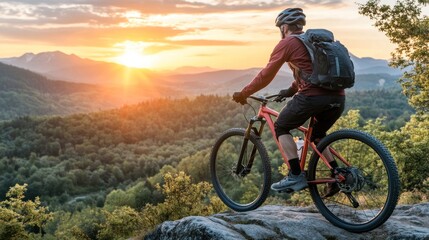 Naklejka premium Mountain Biker at Sunset Overlooking Scenic Vista