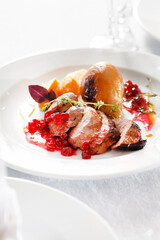 roasted duck with pear on Christmas table